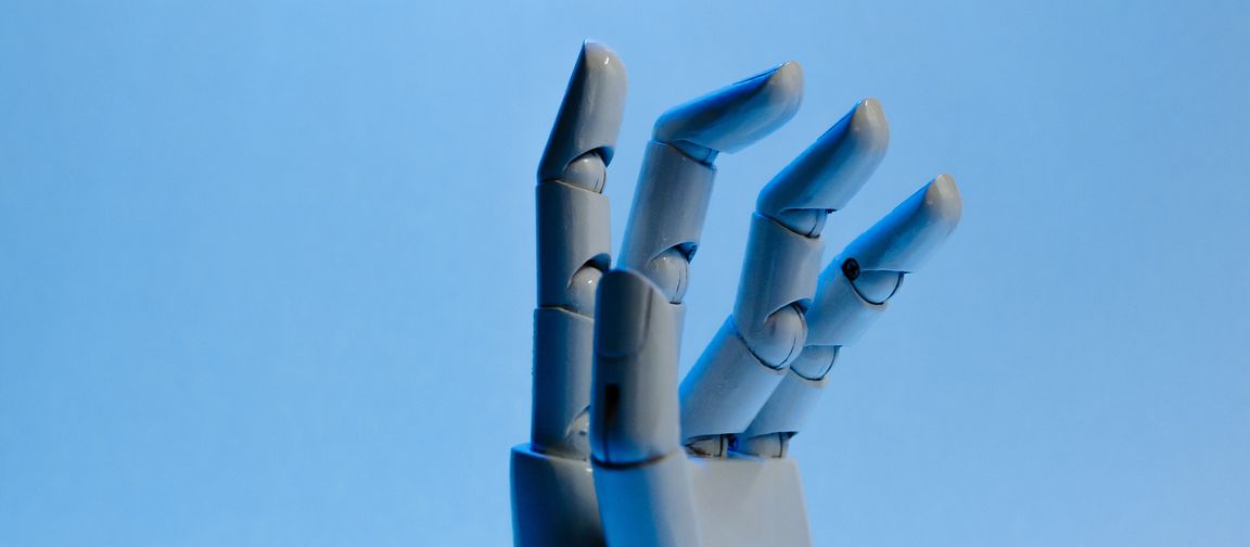 White robotic fingers against a blue background